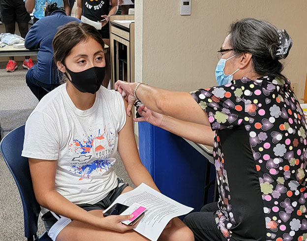 student getting vaccinated