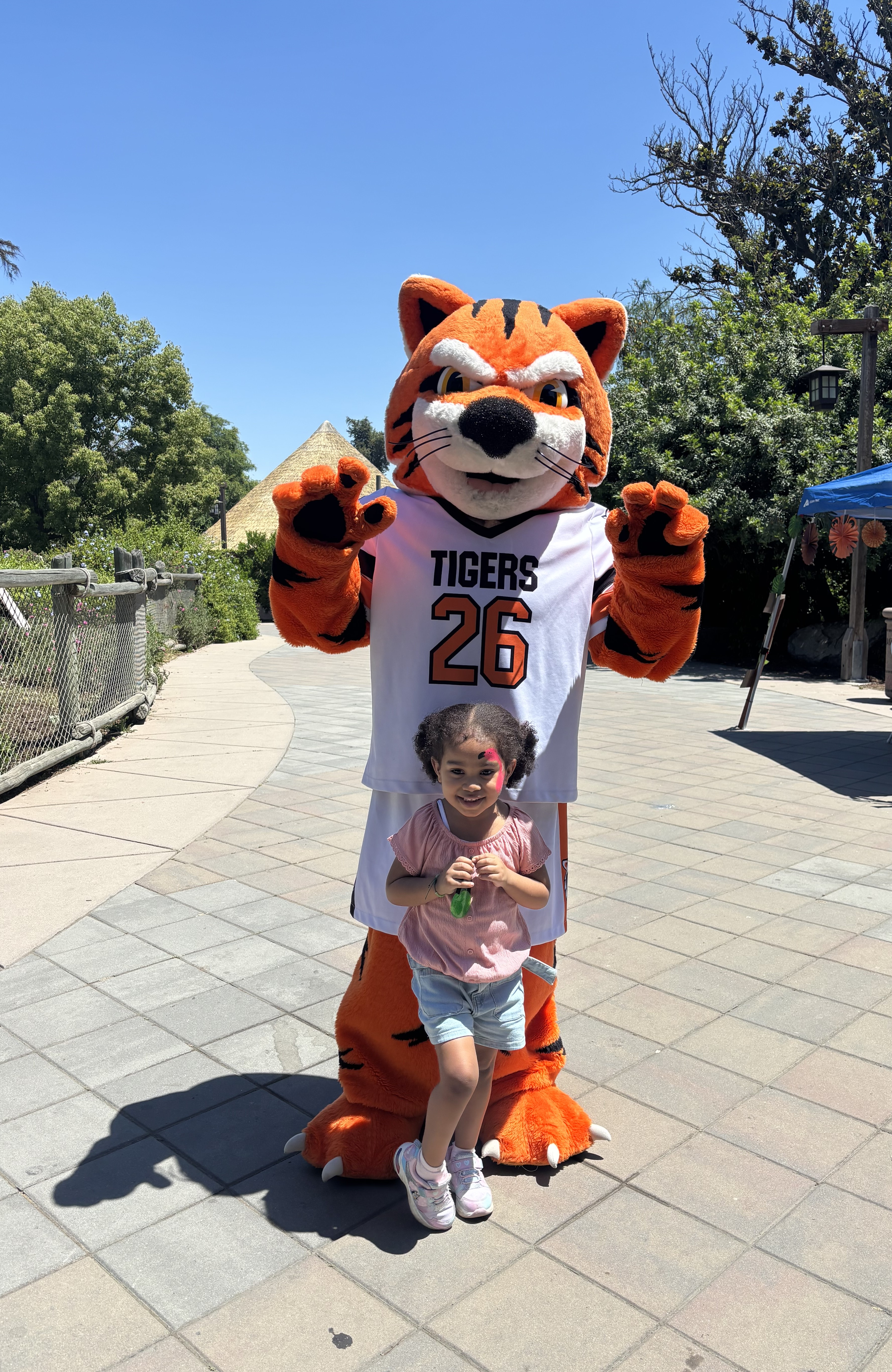 Clyde with posing with young girl at the Chaffee Zoo