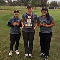 RC Women's Golf holding trophy