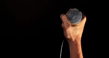 hand on microphone