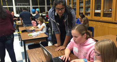 students working on computer