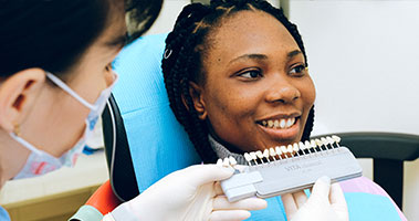 dental assistant measuring teeth