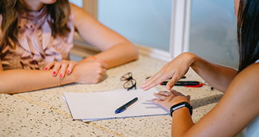 student working on paper