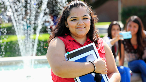 Student holding books