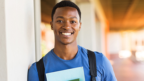 student holding books