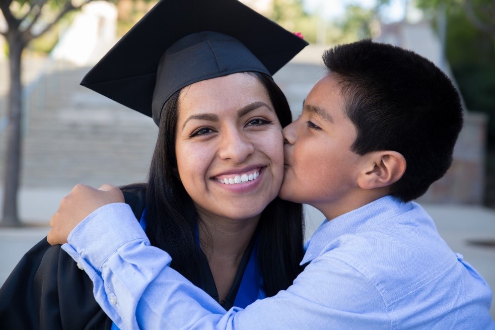 graduating student with child