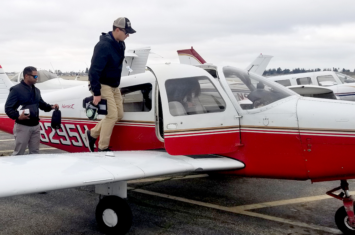 Student Climbing into Cockpit